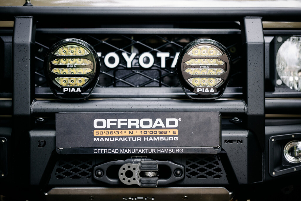 Close-up of the PIAA LPX570 LED lights and WARN winch on the AFN front bumper