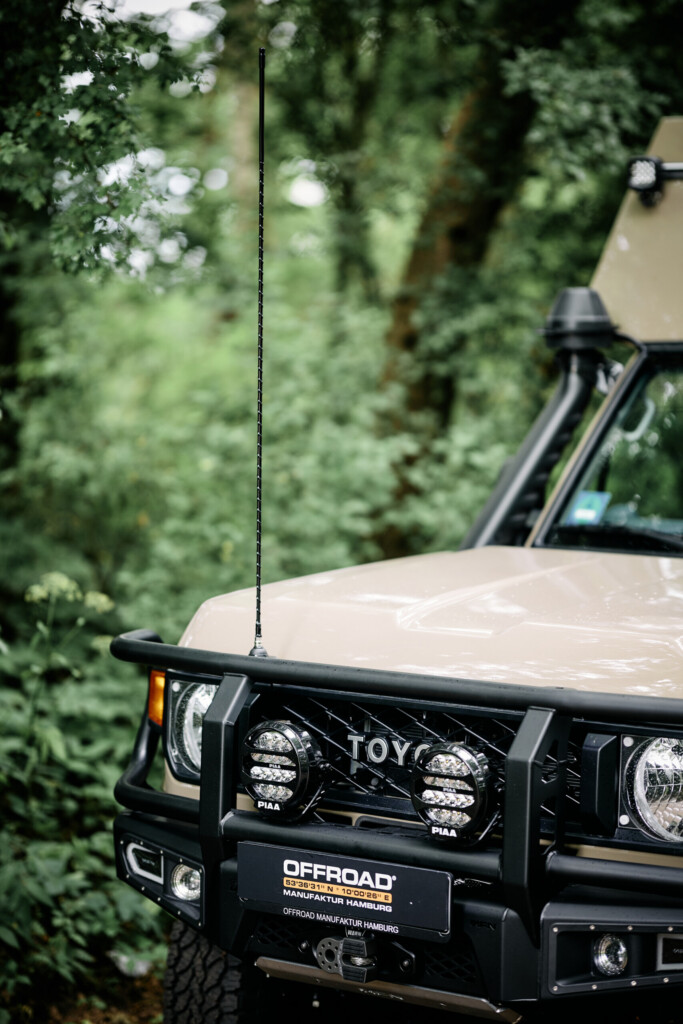 CB radio antenna on the front bumper hoop of the Land Cruiser J7