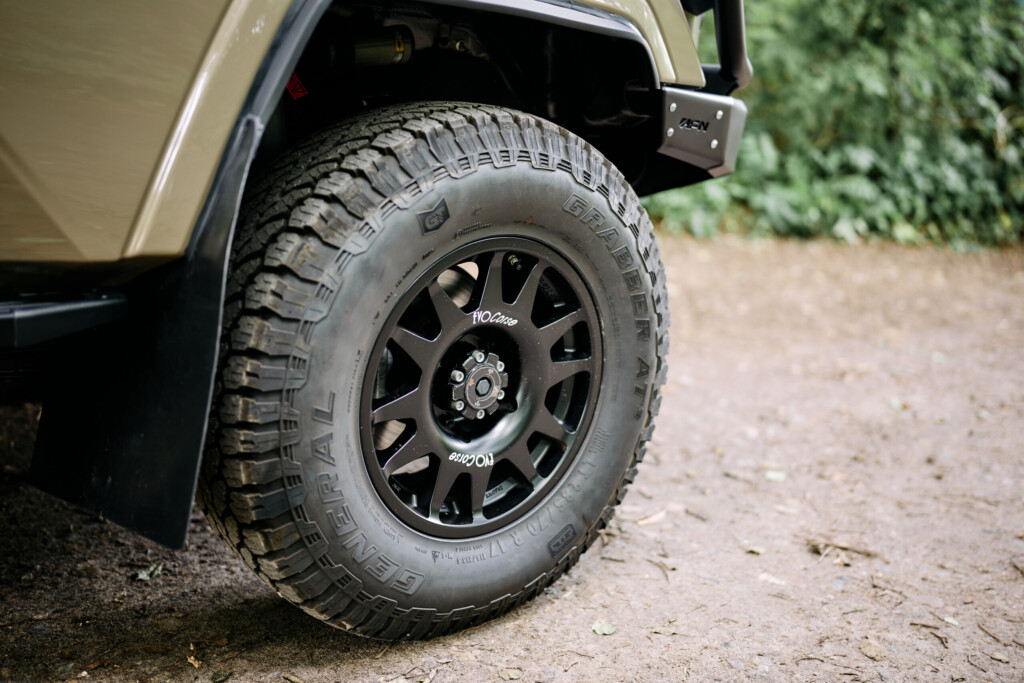 Detail of General Grabber all-terrain tyre on a black EVO Corse wheel on the Land Cruiser J7